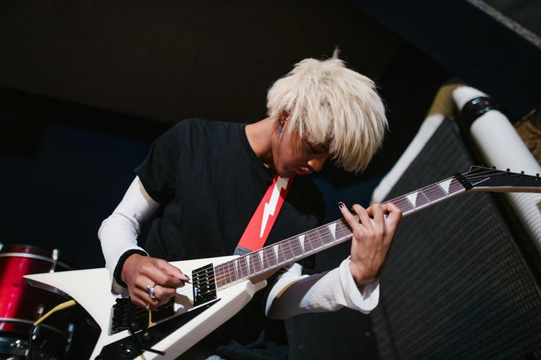 a man with blonde hair playing a guitar, inspired by Tadanori Yokoo, pexels contest winner, short platinum hair tomboy, live performance, bleached, ((tatsuro yamashita))