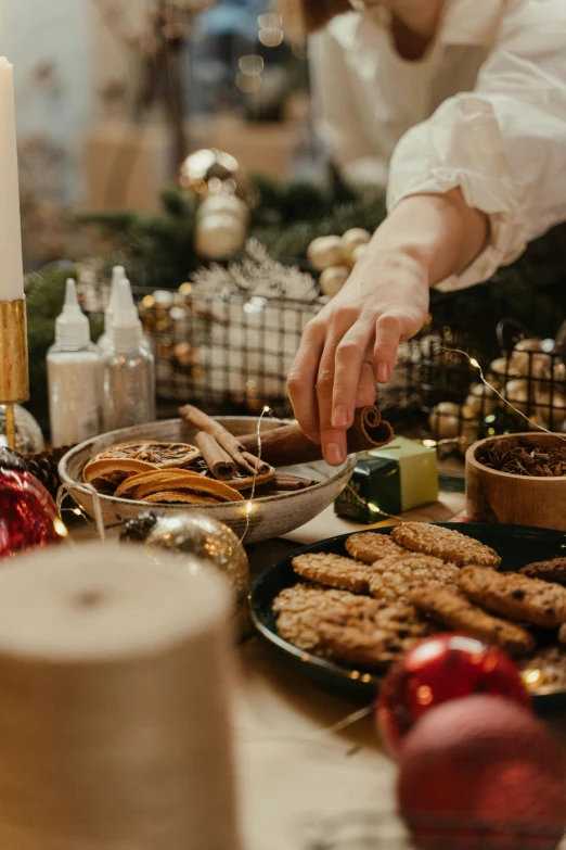 a close up of a person preparing food on a table, ornaments, thumbnail, brown, holiday vibe