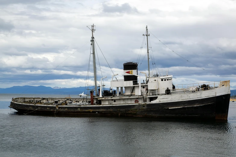 a large boat sitting on top of a body of water, hurufiyya, reykjavik, taken in the early 2020s, steamboat willy, less detailing