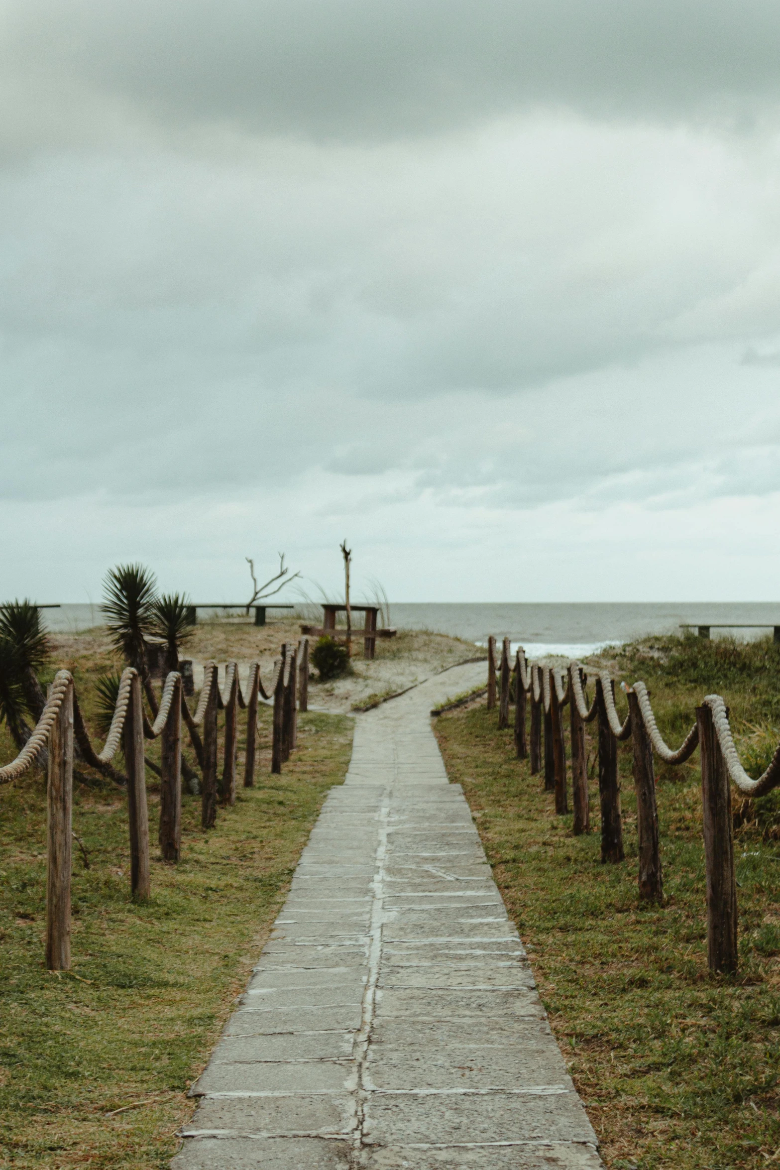 a path leading to a beach on a cloudy day, unsplash, visual art, cemetery, movie set”, color image, multiple stories