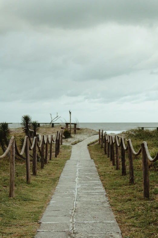 a path leading to a beach on a cloudy day, unsplash, visual art, cemetery, movie set”, color image, multiple stories