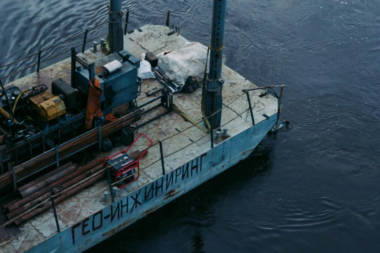 a large boat sitting on top of a body of water, by Attila Meszlenyi, neo norilsk, a high angle shot, documentary still, thumbnail