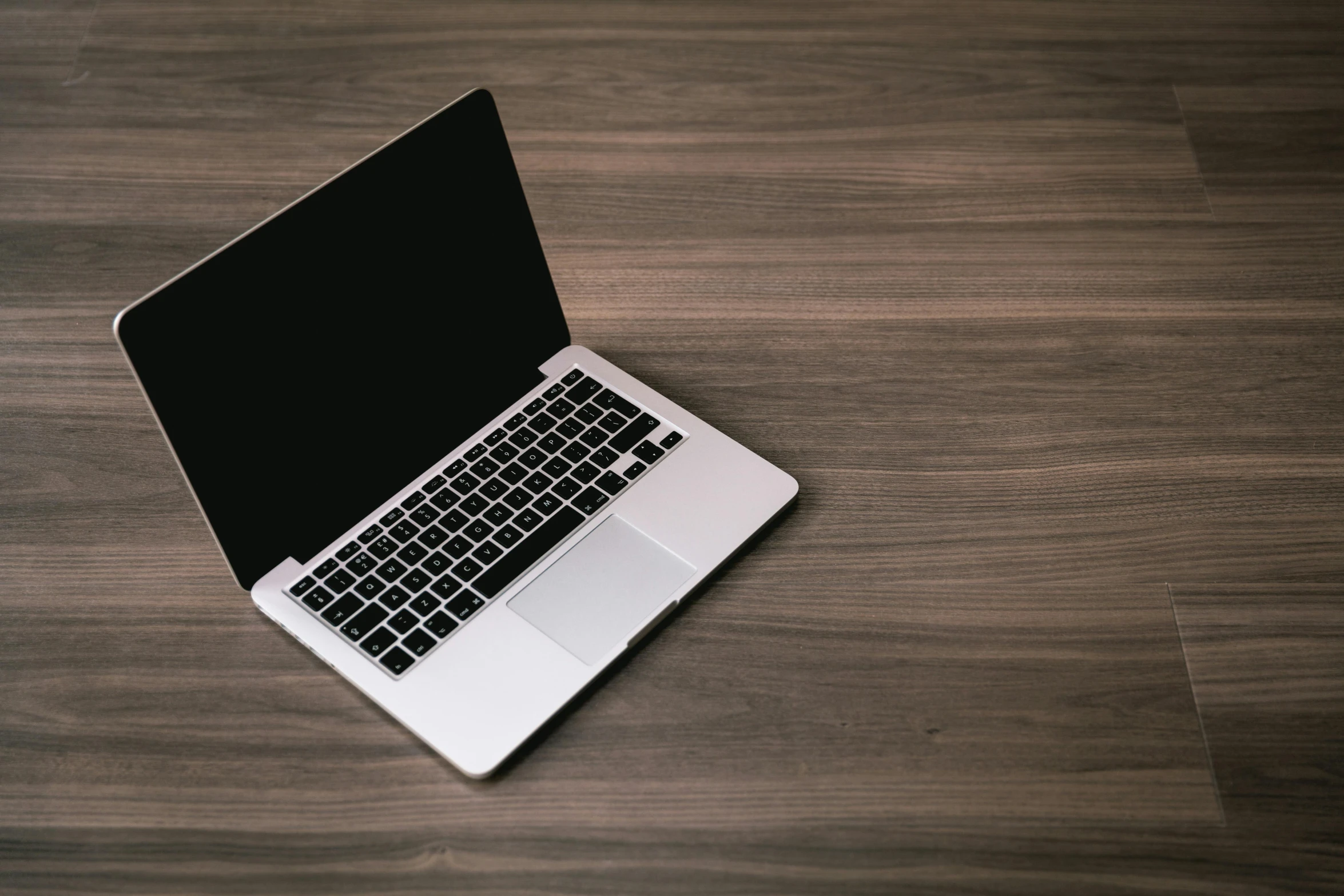 a laptop computer sitting on top of a wooden table, pixabay, lacquered, thumbnail, ebony skin, confident looking