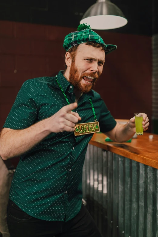 a man sitting at a bar with a beer in his hand, reddit, wearing green clothing, aussie baristas, hr ginger, dabbing