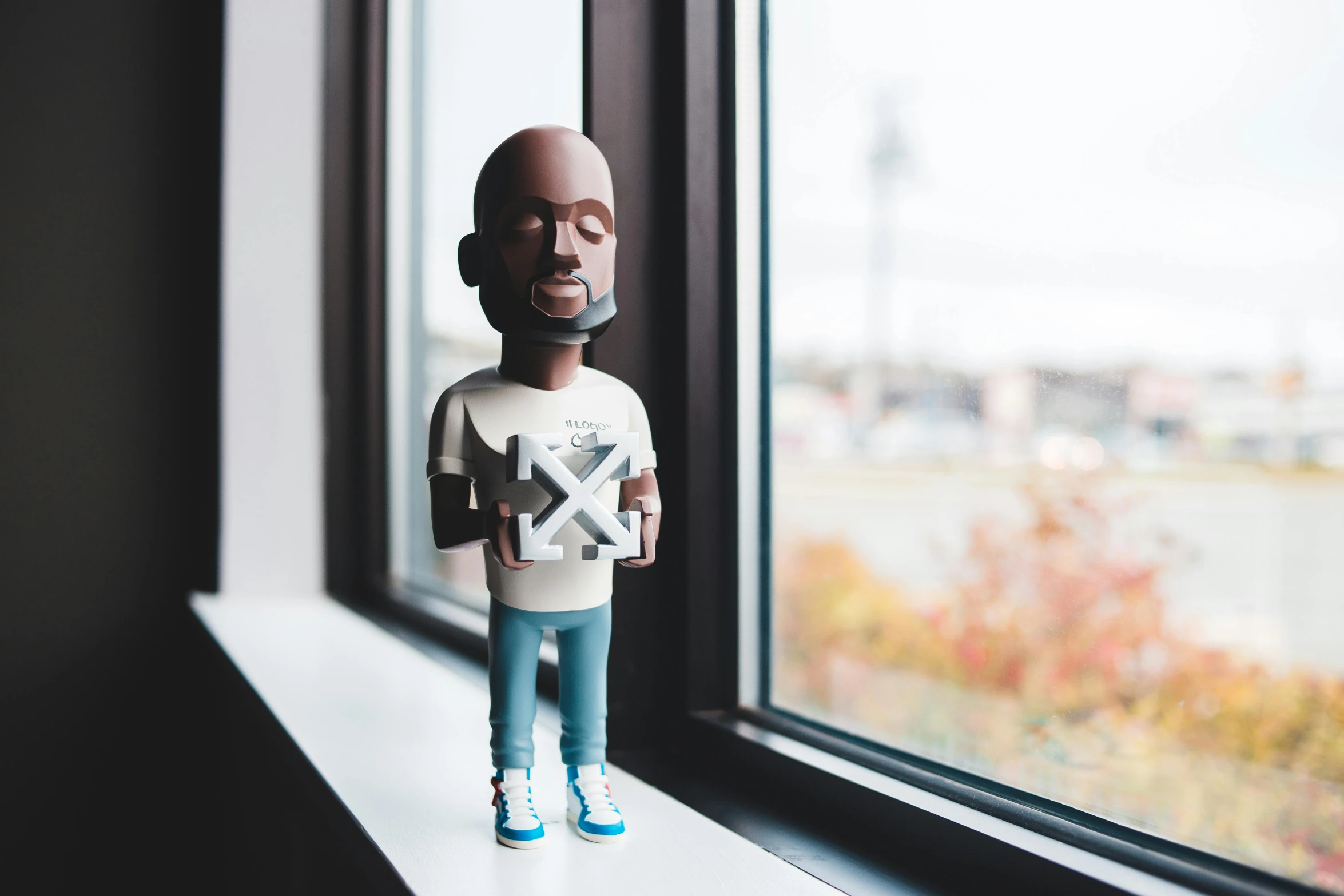 a close up of a toy on a window sill, a statue, by Android Jones, virgil abloh, portrait mode photo, small in size, standing