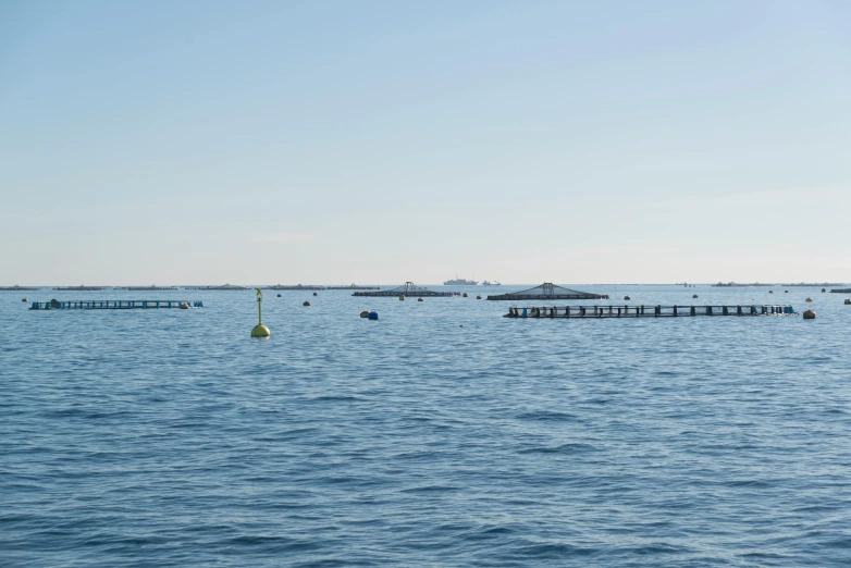 a large body of water filled with lots of boats, unsplash, les nabis, caulfield, blue submarine no 6, clear skies in the distance, david a trampier