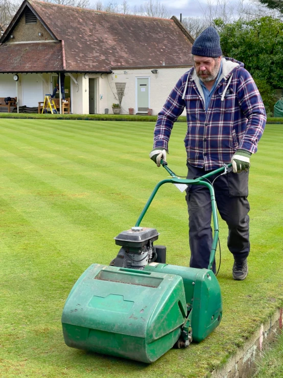 a man that is standing in the grass with a lawn mower, by Kev Walker, happening, off - putting, thumbnail, fine workmanship, profile image