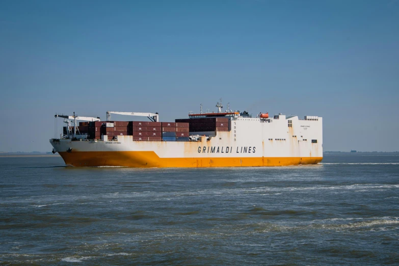 a large cargo ship traveling across a body of water, white and yellow scheme, taken with sony alpha 9, portrait image, adult