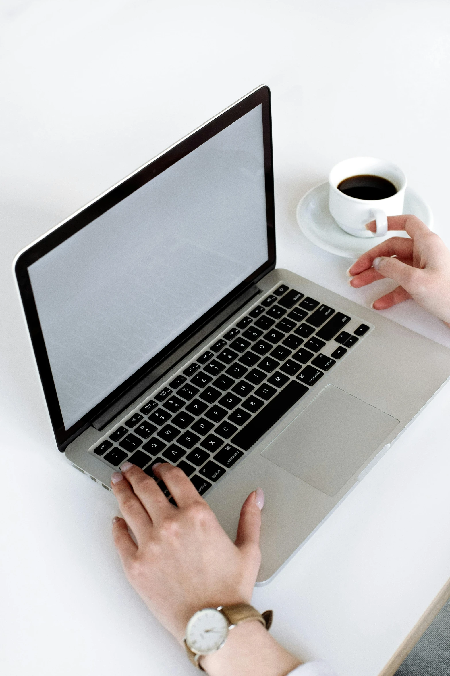 a person sitting at a table with a laptop and a cup of coffee, with a white background, thumbnail, digital image, multiple stories