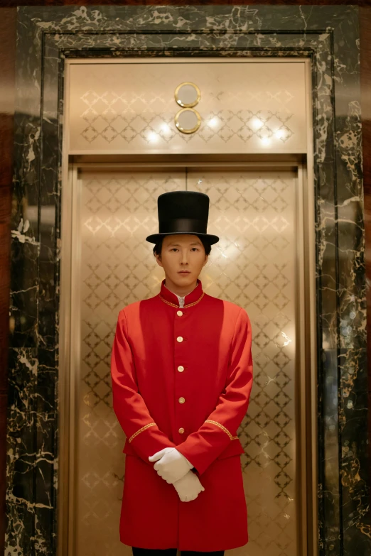 a man in a red uniform stands in an elevator, by Alison Geissler, symbolism, high hat, cai xukun, square, grand