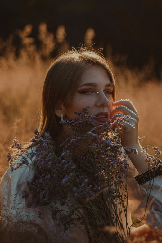 a woman sitting in a field holding a bunch of flowers, a picture, inspired by Elsa Bleda, trending on pexels, aestheticism, backlit beautiful face, jewelry, profile pic, lavender blush