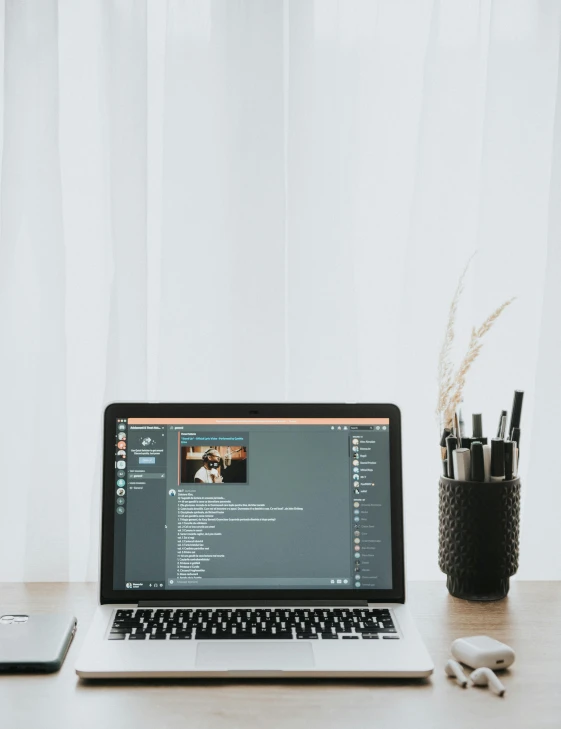 a laptop computer sitting on top of a wooden desk, trending on unsplash, computer art, multiple stories, gif, white background”, low quality photo