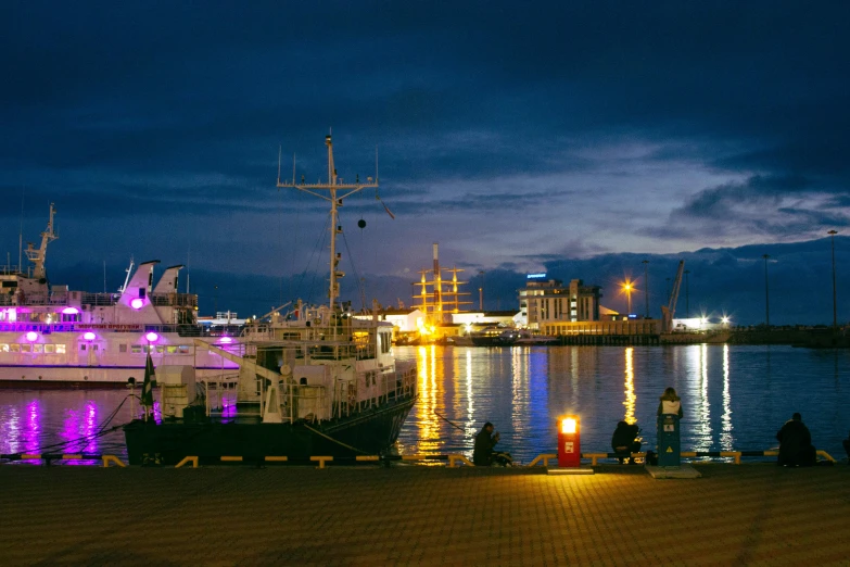 a couple of boats that are sitting in the water, by Julia Pishtar, pexels contest winner, hurufiyya, victorian harbour night, zeppelin dock, thumbnail, seen from outside