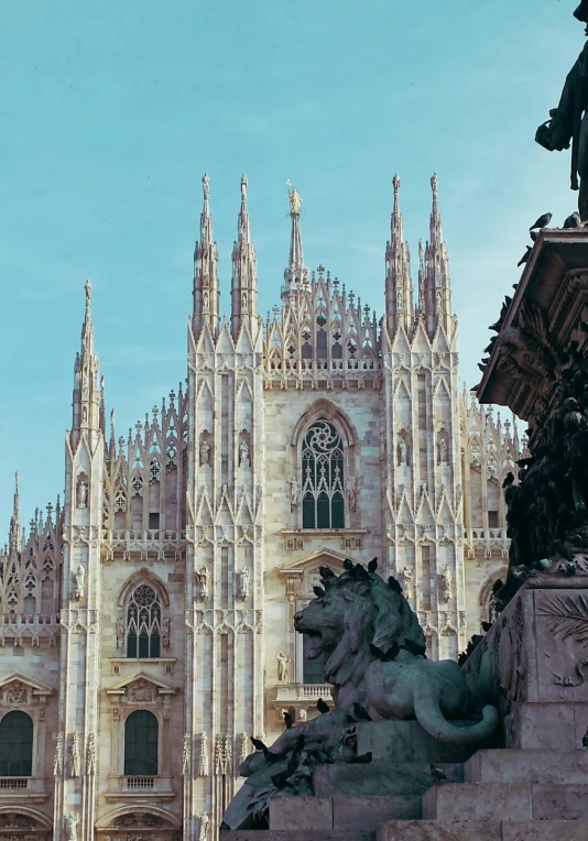 a statue of a lion in front of a cathedral, by Giorgio De Vincenzi, slide show, milan jozing, spires, featured