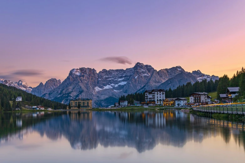 a body of water with mountains in the background, by Carlo Martini, pexels contest winner, renaissance, twilight skyline, lago di sorapis, istock, 8k resolution”