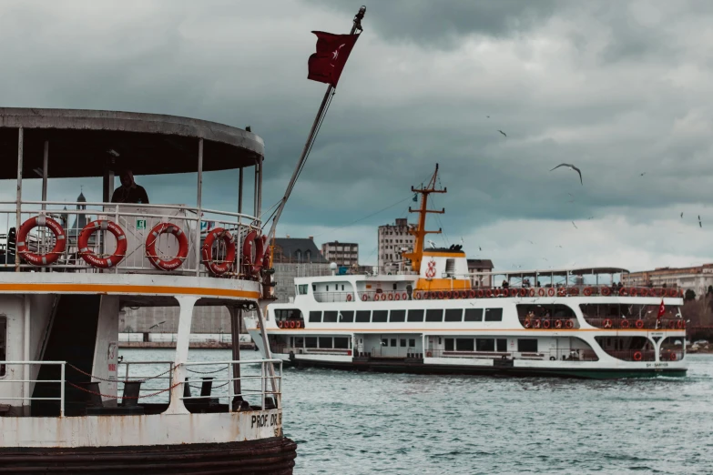 a couple of boats that are in the water, pexels contest winner, hurufiyya, fallout style istanbul, thumbnail, 🚿🗝📝