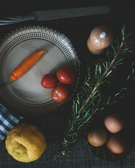 a plate of food sitting on top of a table, a still life, inspired by Andrea del Sarto, unsplash, renaissance, organic ornaments, thumbnail, gray and orange colours, vegetable