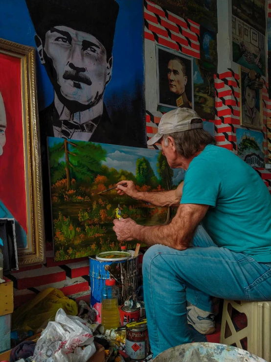 a man sitting on a stool in front of a painting, a fine art painting, inspired by Martiros Saryan, pexels contest winner, socialist realism, cuba, old man doing hard work, photo of putin, avatar image