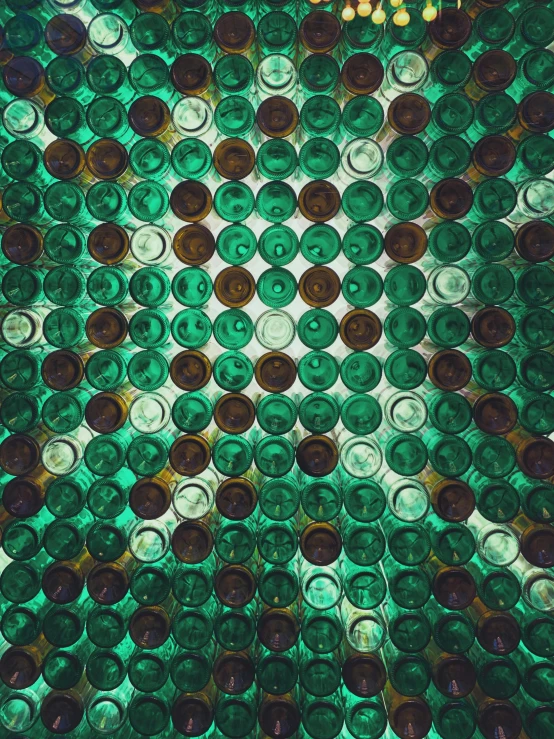 a bunch of glass bottles sitting on top of a table, a mosaic, unsplash, generative art, green: 0.5, symmetrical image, multiple stories, made of drink
