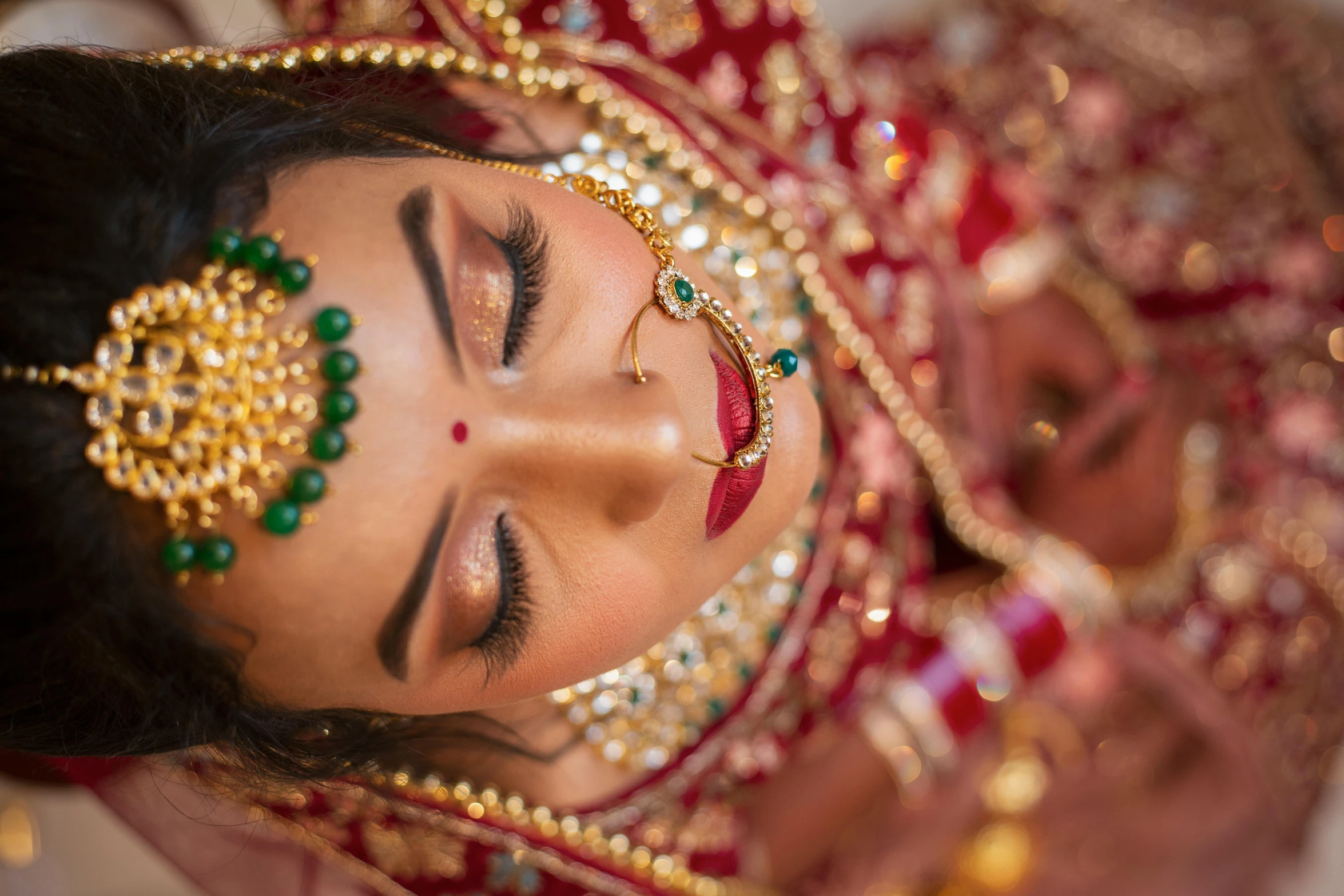 a close up of a woman in a red and gold outfit, pexels contest winner, hurufiyya, laying down, bride, #green, indian