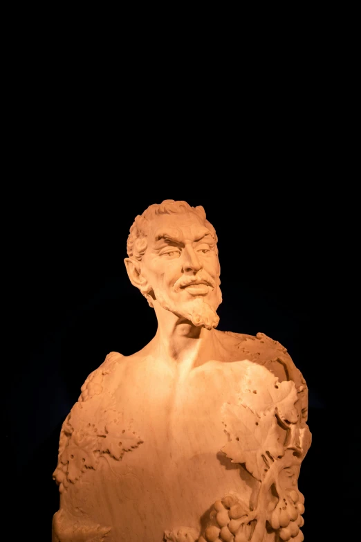 a close up of a statue of a man, with a black background, claymation character, light beard, museum lighting