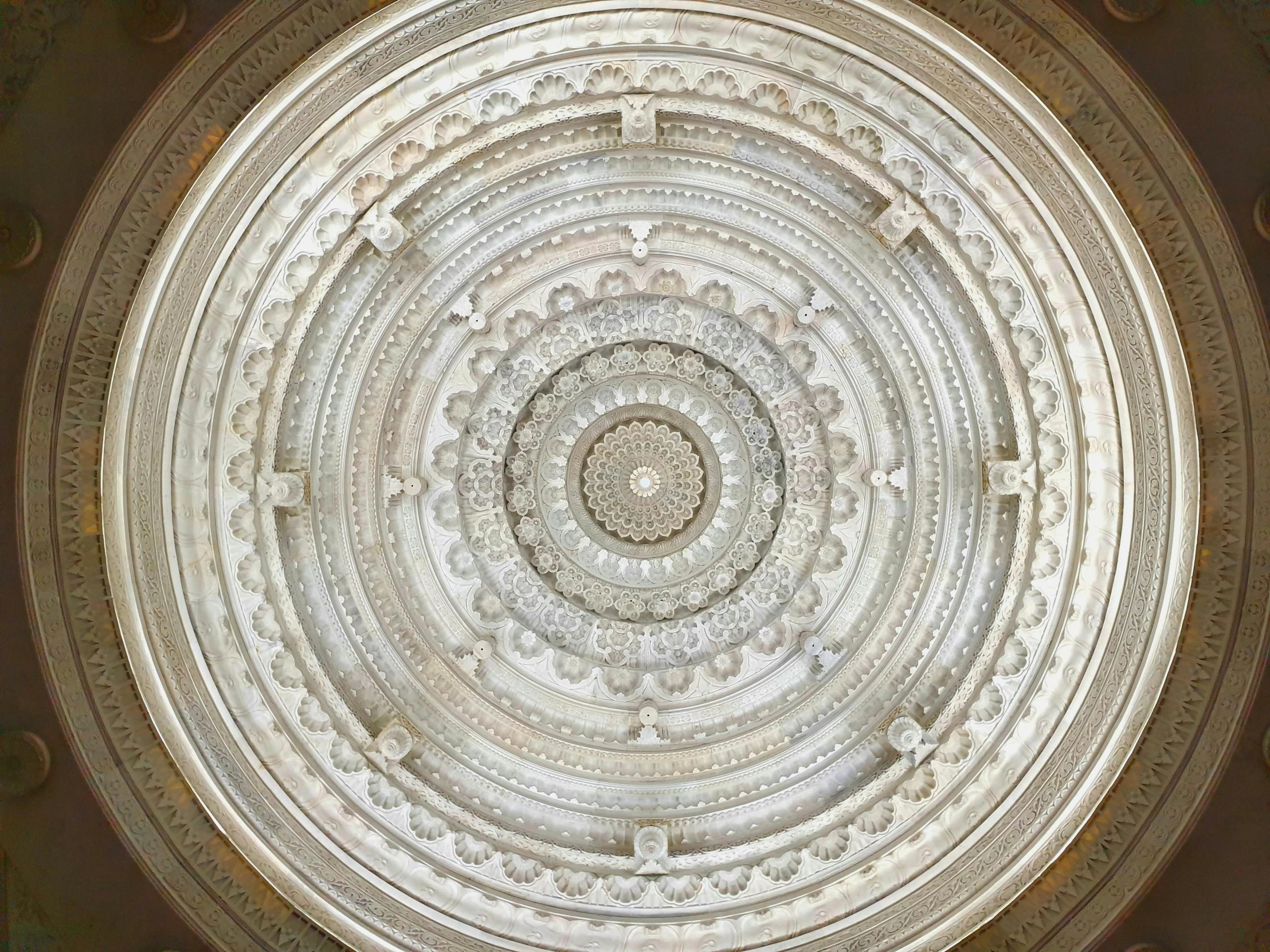 the ceiling of a building with a circular design, inspired by Anna Füssli, baroque, intricate stone carvings, kalighat highly detailed, tall ceilings, white ceiling