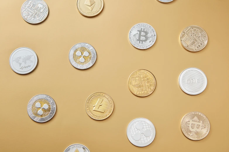 a bunch of coins sitting on top of a table, society 6, crypto, clemens ascher, high angle close up shot