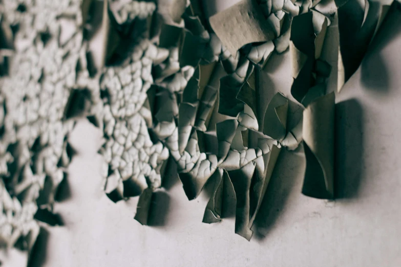 a bunch of pieces of paper hanging on a wall, inspired by Elsa Bleda, pexels contest winner, concrete art, fractured, lichen, broken tiles, 15081959 21121991 01012000 4k