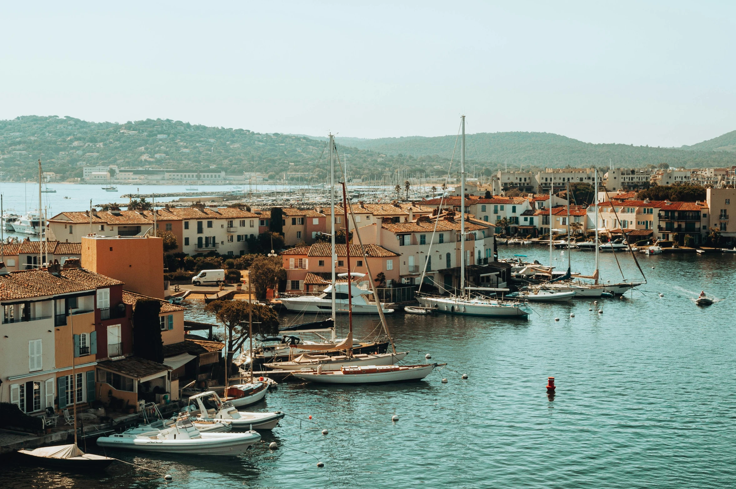 a large body of water filled with lots of boats, pexels contest winner, les nabis, french village exterior, 🦩🪐🐞👩🏻🦳, moody : : wes anderson, clear and sunny