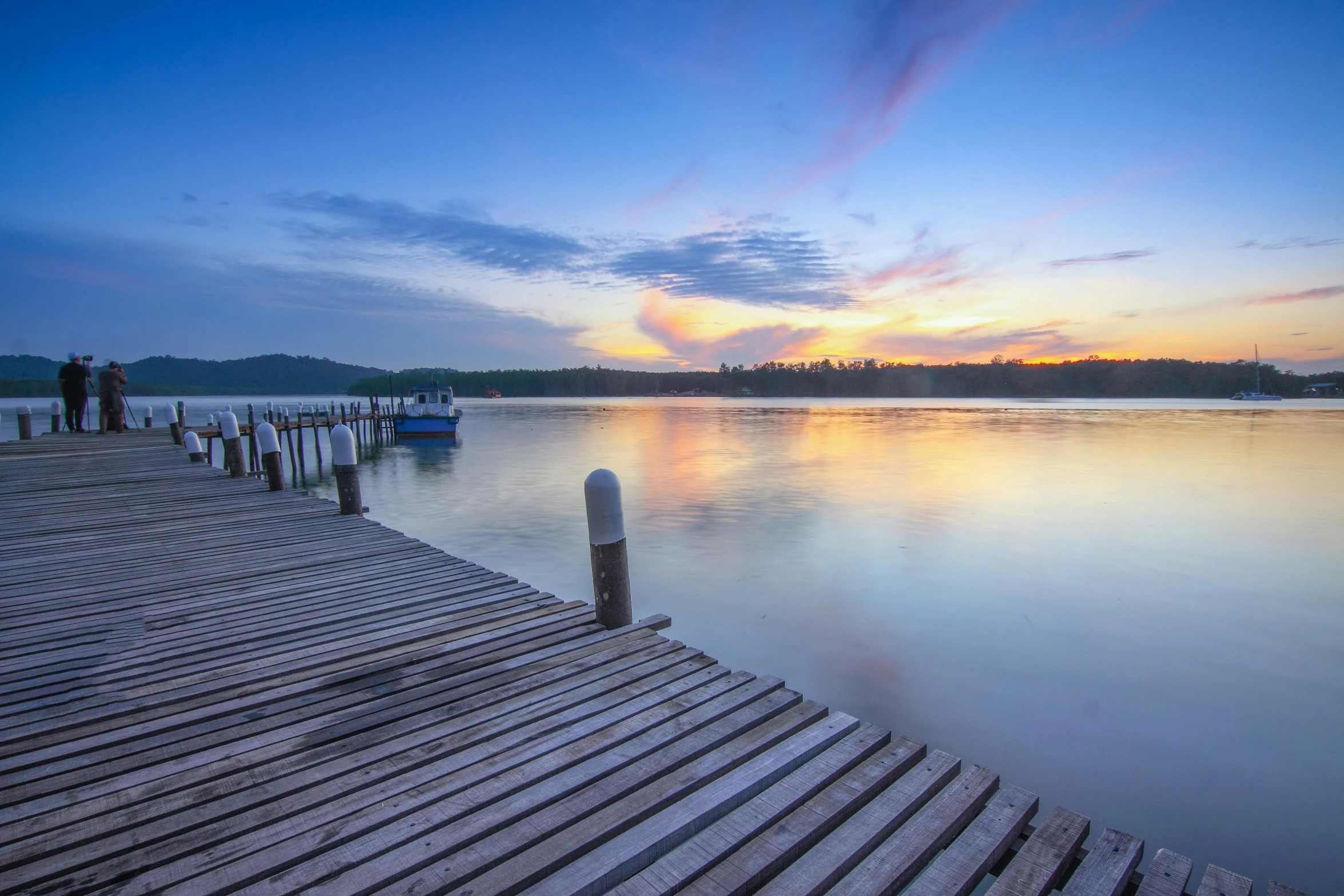 a dock that is next to a body of water, pexels contest winner, pastel sunset, picton blue, wide river and lake, album