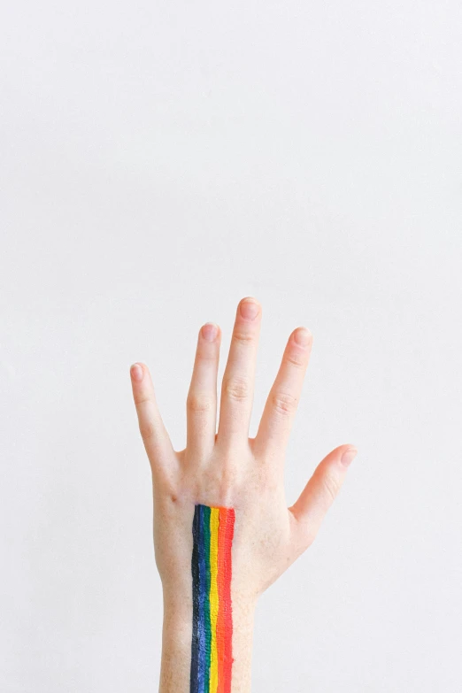 a hand with a rainbow painted on it, an album cover, unsplash, bauhaus, ilustration, barbara canepa, 256435456k film, tall thin