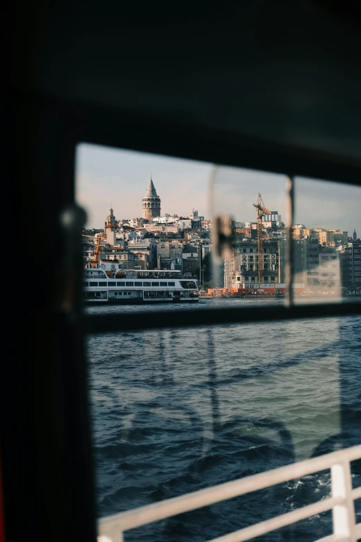 a view of a city through a window, by Tobias Stimmer, pexels contest winner, on a boat, slide show, turkey, cinematic shot ar 9:16 -n 6 -g