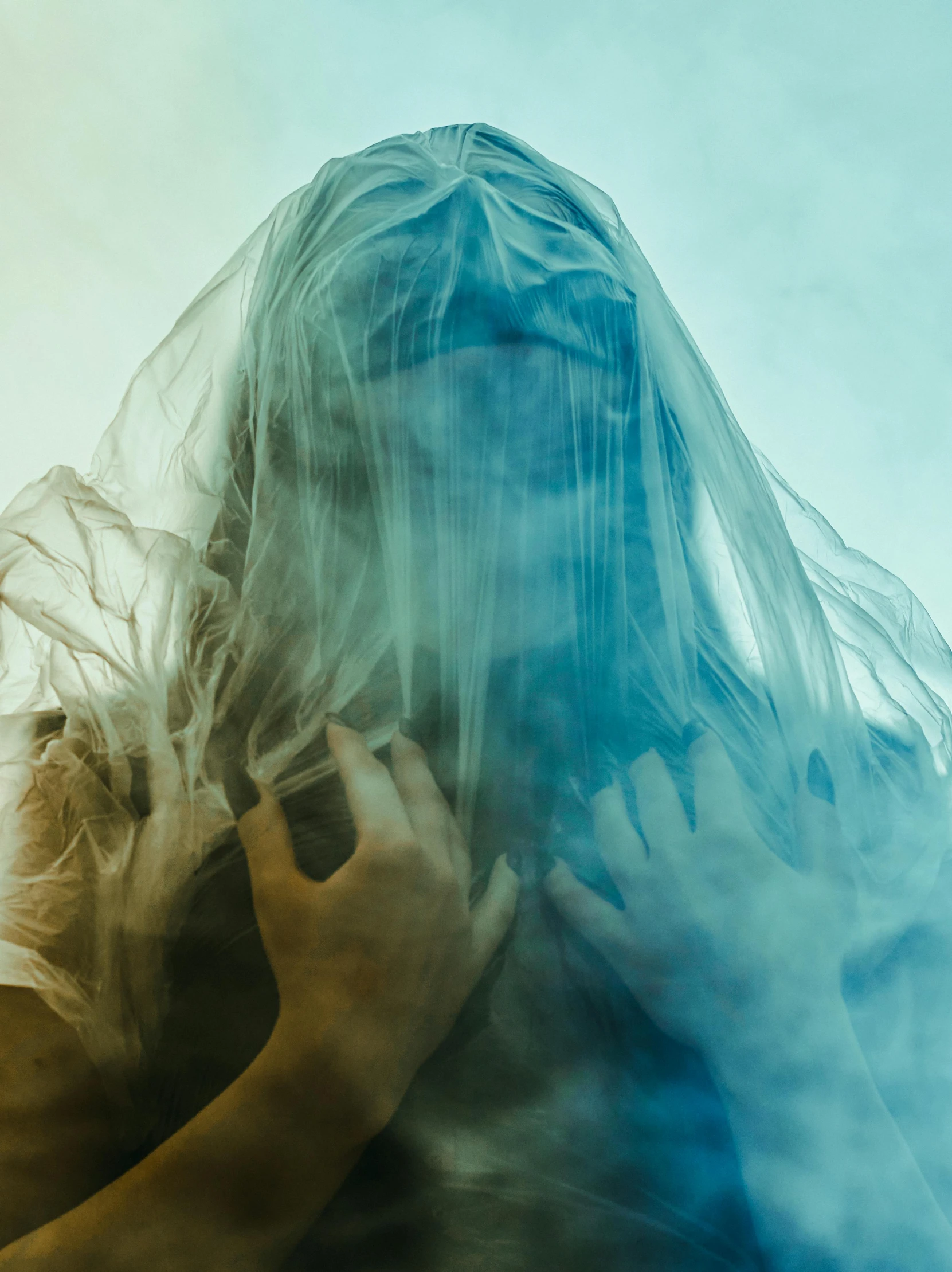a woman with a veil covering her face, an album cover, inspired by Elsa Bleda, unsplash, surrealism, acid color smoke, woman holding another woman, ghosts, raziel irl