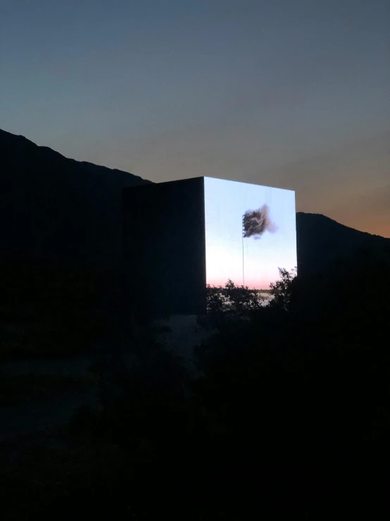 a light box sitting in the middle of a field, by Alexis Grimou, video art, hillside desert pavilion, large commercial led screens, # nofilter, ((monolith))