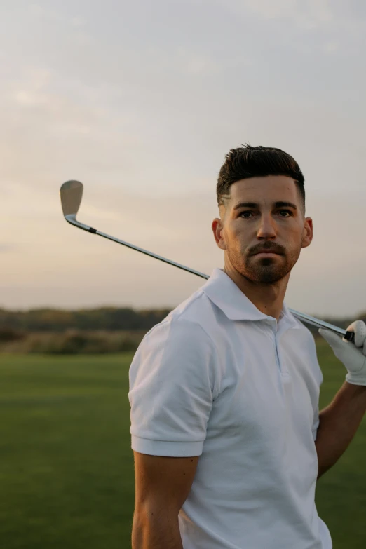 a man in a white shirt holding a golf club, inspired by david rubín, mark edward fischbach, handsome, looking off into the distance, avatar image