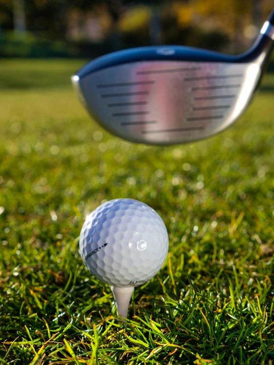 a golf ball on a tee next to a golf club, inspired by Shirley Teed, high quality product image”, dynamic closeup, thumbnail, large)}]