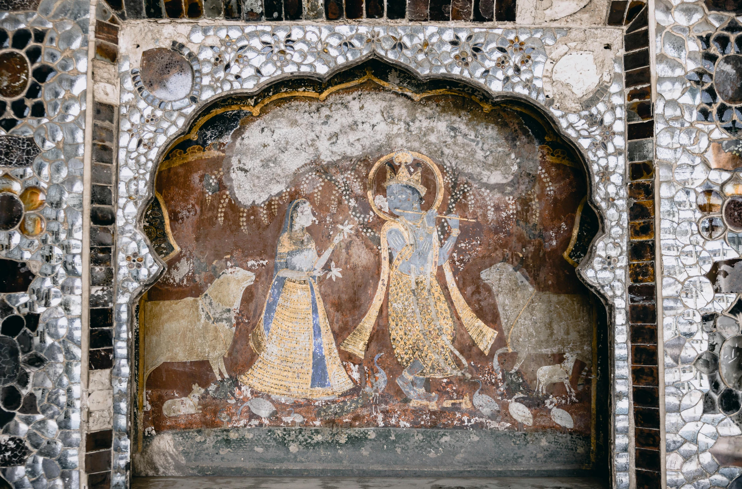 a painting on the side of a building, a detailed painting, trending on unsplash, qajar art, ellora, an archway, thumbnail, a painting of two people