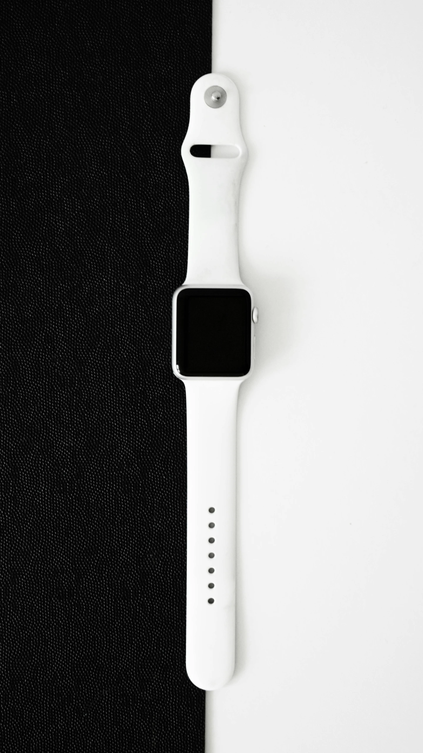 an apple watch sitting on top of a black and white surface, minimalism, white uniform, thumbnail, 0 0 0, pitt