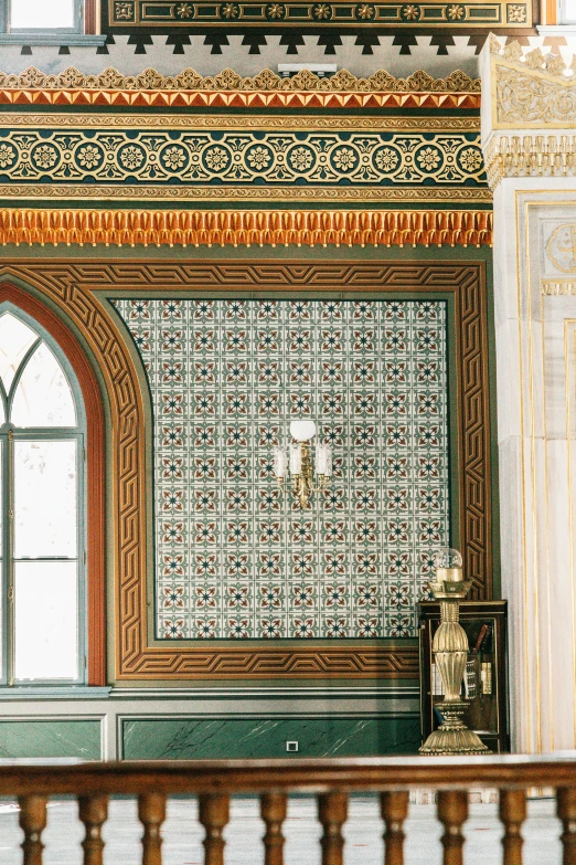 a clock mounted to the side of a wall in a building, a mosaic, inspired by Sydney Prior Hall, trending on unsplash, baroque, mosque interior, 2 5 6 x 2 5 6 pixels, exquisitely designed throne room, sconces