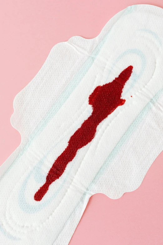 a cloth pad with a blood stain on it, by Julia Pishtar, hurufiyya, obi strip, goop, lgbtq, features