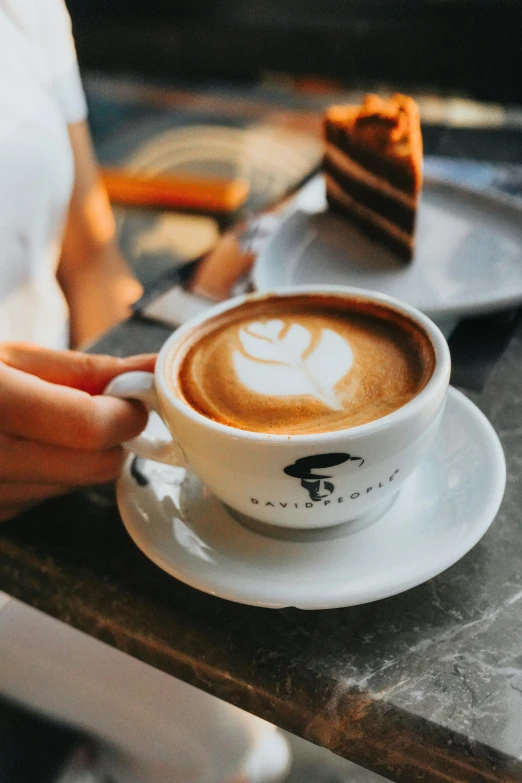 a person sitting at a table with a cup of coffee, inspired by Carlo Randanini, renaissance, aussie baristas, jakarta, profile image