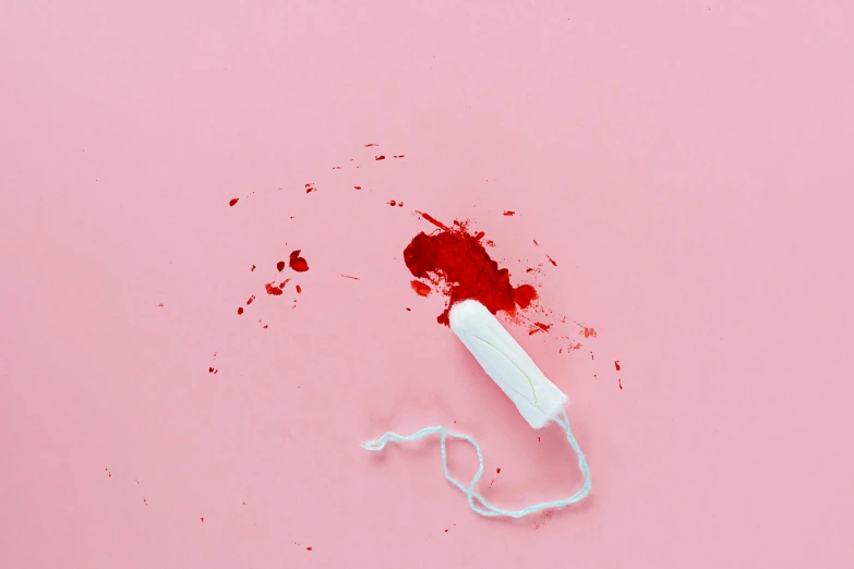 a white toothbrush sitting on top of a pink surface, an album cover, by Elsa Bleda, pexels contest winner, plasticien, violence blood, stab wound, acryllic spill, ribbon