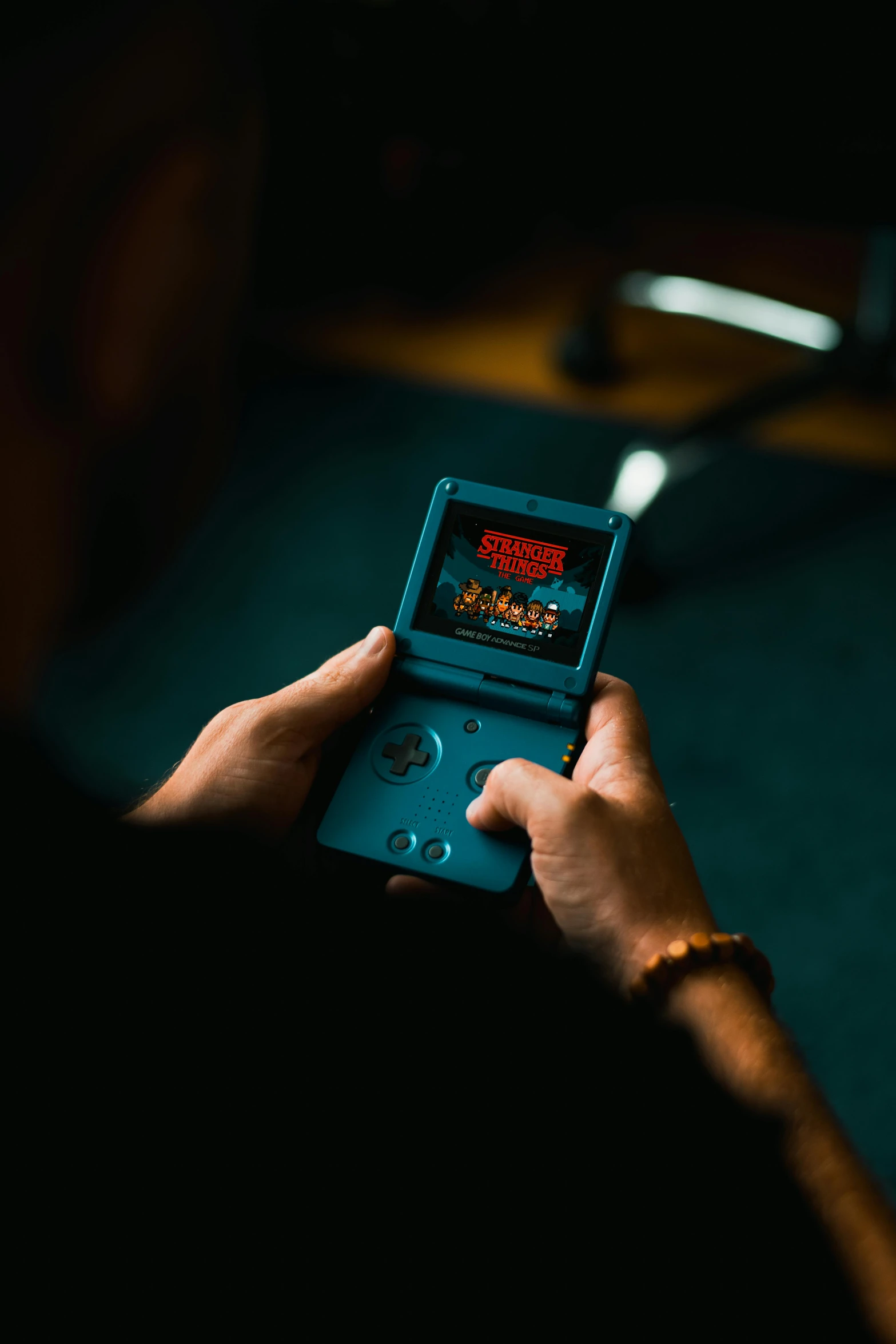 a person holding a game boy in their hand, unsplash, 2 5 6 x 2 5 6 pixels, fighting game, donkey kong country, gaming room