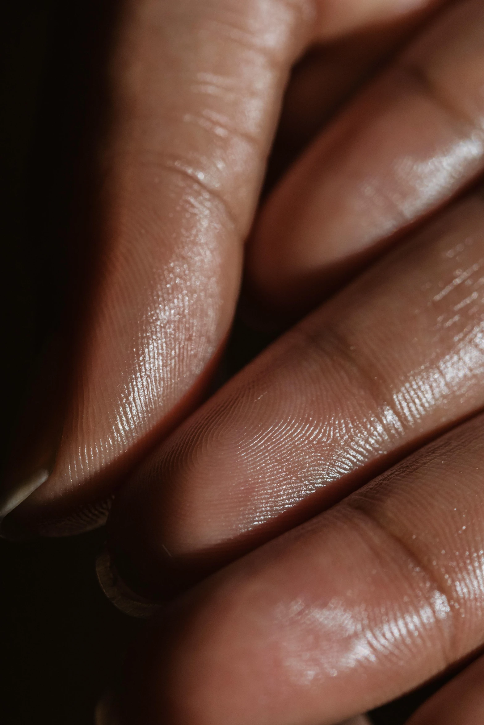 a close up of a person's hand holding a diamond, a stipple, smooth bioluminescent skin, fingerprints on clay, photorealistic skin tone, oiled skin