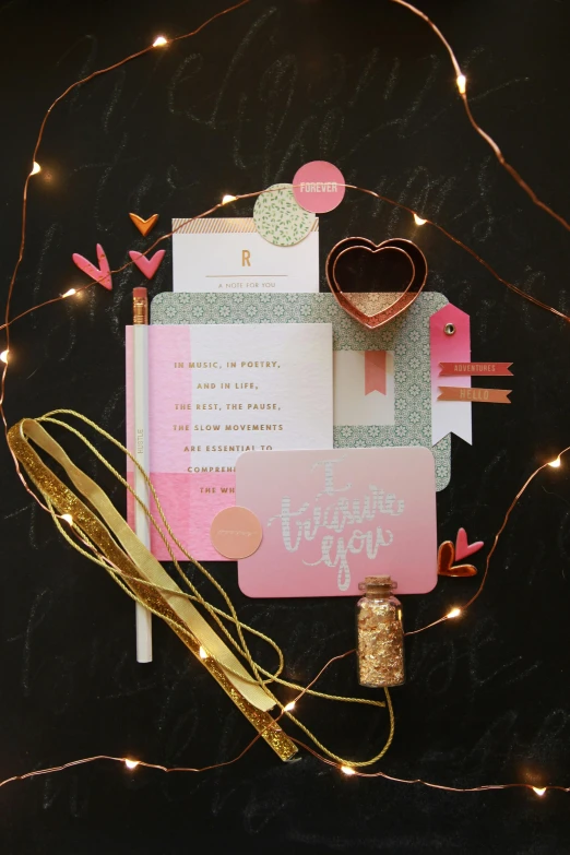 a couple of cards sitting on top of a table, rose gold heart, moodboard, glowing accents, highlights