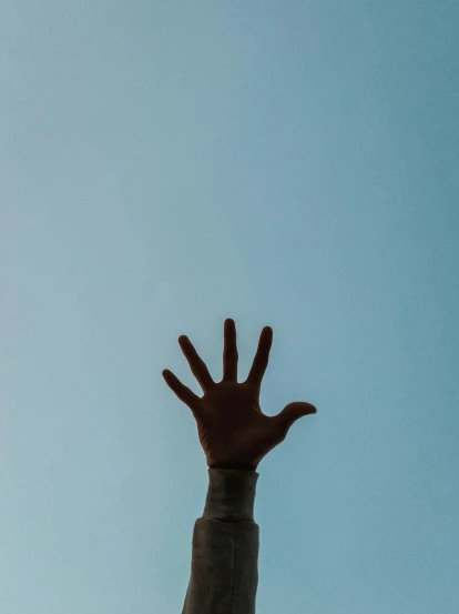 a person reaching up into the sky to catch a frisbee, trending on unsplash, symbolism, hand with five fingers, ((blue)), brown, hand instead of a face