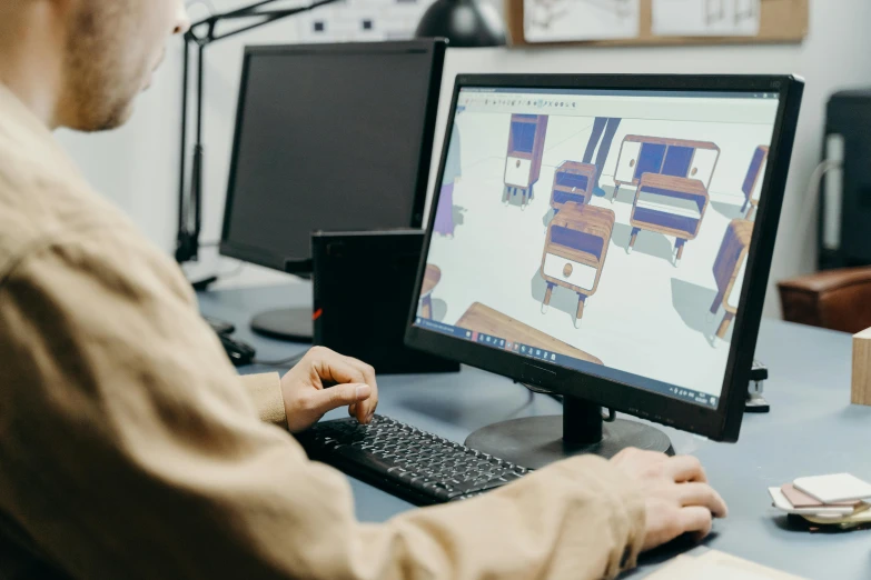 a man sitting at a desk working on a computer, trending on polycount, architectural planning, avatar image