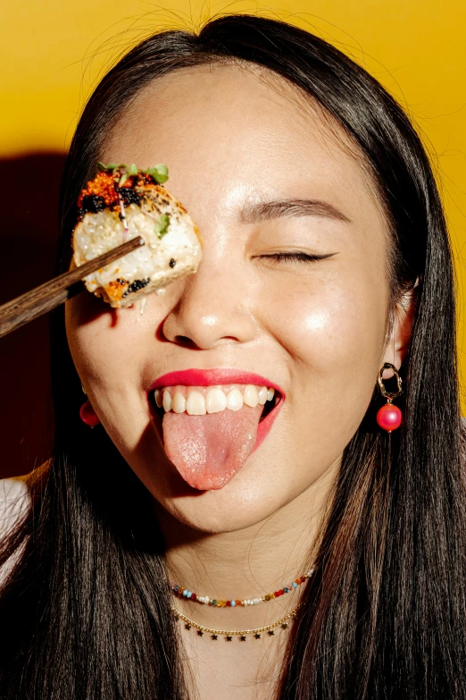 a woman eating sushi with a pair of chopsticks, by Julia Pishtar, underbite, laughing maniacally, profile image, closeup of face