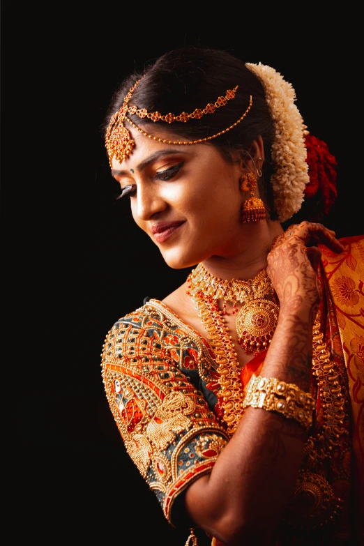 a woman in a sari poses for a picture, trending on cg society, art photography, ornate and intricate jewelry, sri lanka, orange skin. intricate, bride