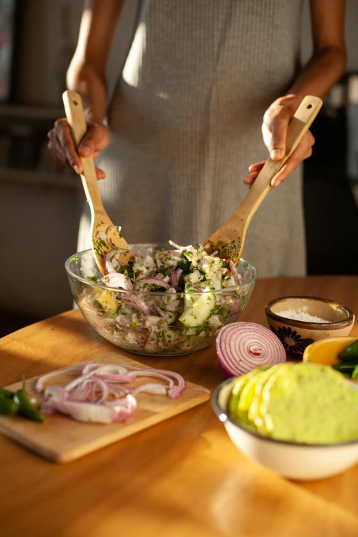 a woman preparing a salad in a kitchen, process art, extra pickles and onions, fan favorite, rice, sleek hands